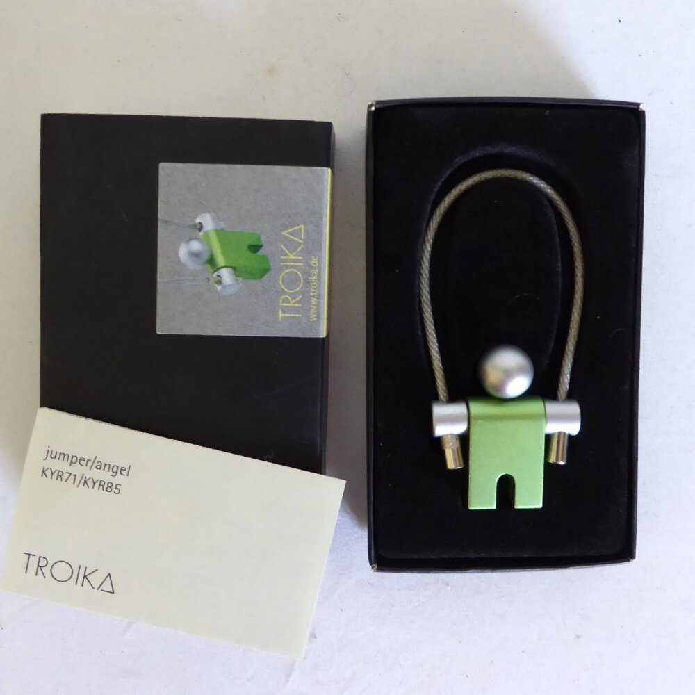 VINTAGE NEW IN BOX TROIKA RING GREEN JUMPER ANGEL ALUMINUM KEYCHAIN